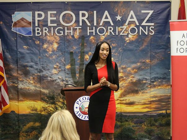 Joysaphine Waitman-Powell speaking at a Peoria Bright Horizons event